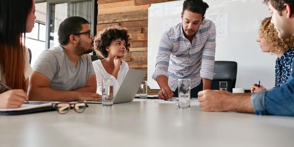 Team meeting around conference table in modern office